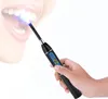 A hand holding a dental curing light device, with the light beam directed at teeth. Produktbild-Vorschau