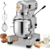 A commercial kitchen stand mixer with various attachments, bread, eggs, flour, and milk are displayed around it. Produktbild-Vorschau