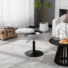 A modern living room setting with a stool, a chest, and a coffee table. Produktbild-Vorschau