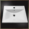 A white ceramic sink with two holes, one for a faucet and one for a drain, against a black background. Voir les images du produit