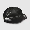 The back view of a black trucker cap with white and purple accents. Produktbild-Vorschau