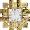 A close-up view of a decorative wall clock with a gold frame and Roman numerals. Voir les images du produit