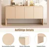 A light wood sideboard with four doors is shown, with close-up details of its design elements below. The sideboard is decorated with small appliances and bottles on top. Anteprima dell’immagine prodotto