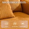 A close-up of a textured orange fabric, possibly a sofa or cushion, with overlayed text and icons describing its properties. Voir les images du produit