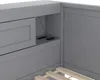 Close-up view of a gray wooden bed frame with integrated storage and charging ports. Podgląd zdjęcia produktu
