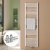 A white towel radiator with a towel hanging on it, mounted on a tan wall. A close-up inset shows a chrome valve system. Produktbild-Vorschau