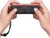 Hands holding a Nintendo Joy-Con controller. Produktbild-Vorschau