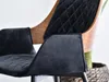 Close-up of a black upholstered chair with wooden accents. Náhled obrázku produktu