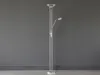 A silver floor lamp with two lights against a gray wall. Náhled obrázku produktu