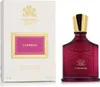 A perfume bottle and its packaging are displayed side-by-side against a white background. Voir les images du produit