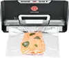 A vacuum sealer is shown sealing a piece of salmon in a plastic bag. Podgląd zdjęcia produktu