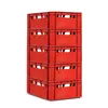 A stack of red plastic crates against a white background. Voir les images du produit