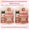 A split image showing a pink children's vanity table with a mirror and stool, with one side showing the mirror without lights and the other side showing the mirror with integrated LED lighting. Voir les images du produit