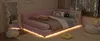 A pink corner daybed with ambient lighting in a bedroom setting. Podgląd zdjęcia produktu