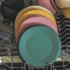 Stack of colorful plates in a dishwasher rack. Náhľad obrázku produktu