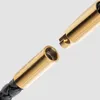 Close-up of a gold clasp on a black braided leather necklace. Produktbild-Vorschau