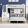 A white bunk bed with storage and a lower bed, set against a blue wall. Náhled obrázku produktu