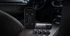 A smartphone displaying tire pressure data and a dashcam with tire pressure sensors are placed on a car seat. Náhľad obrázku produktu