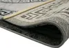 A close-up view of a folded rug, showing its texture and border pattern. Produktbild-Vorschau
