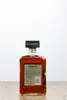 A bottle of Disaronno Originale Amaretto liqueur is shown against a white background and a wooden surface. Produktbild-Vorschau