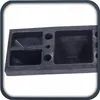 A close-up view of a black rubber parking stopper with multiple compartments. Produktbild-Vorschau