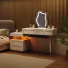 A bedroom scene with a vanity table and a bed. Voir les images du produit