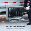 A person is placing a toolbox into a silver truck underbody storage box. Anteprima dell’immagine prodotto