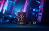 A deck of Bicycle playing cards with a cyberpunk theme is displayed in front of a futuristic city background. Voir les images du produit