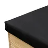 A close-up view of the corner of a wooden box with a black fabric cover. Anteprima dell’immagine prodotto