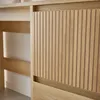 A close-up view of a wooden desk with ribbed drawer fronts. Produktbild-Vorschau
