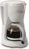 A white DeLonghi drip coffee maker with a glass carafe filled with coffee, placed on a white background. Produktbild-Vorschau