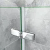 A close-up view of a shower enclosure hinge attached to glass panels against a tiled wall. Produktbild-Vorschau