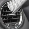 A close-up shot of a car air vent with a cleaning tool inserted. Produktbild-Vorschau