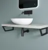 A modern bathroom sink with a wall-mounted faucet and a concrete-look shelf. Produktbild-Vorschau