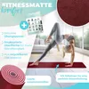 A woman is performing a yoga pose on a red yoga mat in a bright, modern room. The image also features text and graphics highlighting the product's features. Produktbild-Vorschau