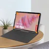 A tablet in a case is displayed on a wooden table next to a potted plant. Produktbild-Vorschau