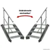 Two identical metal staircases with handrails are shown against a white background, with an arrow indicating that the railing side is interchangeable. Náhled obrázku produktu