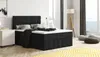A black upholstered bed with a mattress and pillows in a well-lit bedroom with a large window. Produktbild-Vorschau