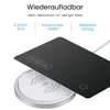 A black card-like object is placed over a white wireless charging pad. Produktbild-Vorschau