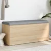 A storage bench with a padded top is shown against a white wall. Voir les images du produit