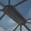 Close-up view of the roof structure of a gazebo, showing the polycarbonate panels and metal frame. Podgląd zdjęcia produktu