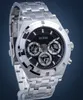 A close-up studio shot of a silver Guess watch with a black face. Náhled obrázku produktu