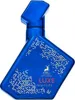 A blue perfume bottle with white pixelated designs and gold text. Produktbild-Vorschau