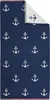 A folded navy blue towel with a pattern of white anchors, with a small section of the reverse side showing. Produktbild-Vorschau