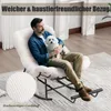 A man is sitting in a rocking chair holding a small white dog. Produktbild-Vorschau