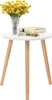 A small round white table with three wooden legs, on which a vase of yellow flowers and two books are placed. Produktbild-Vorschau