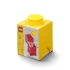 A yellow LEGO storage brick with a red interior and a yellow lid, shown against a white background. Produktbild-Vorschau