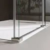 A close-up view of a modern shower enclosure with glass panels and chrome fixtures. Produktbild-Vorschau