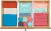 An open drawer with clothing neatly organized using drawer dividers. Produktbild-Vorschau