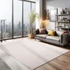 A modern living room with a large window overlooking a city skyline, featuring a sofa, rug, and plant. Náhled obrázku produktu